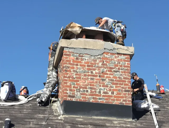 Palm Harbor Chimney Sweep installing a custom chimney crown in Palm Harbor, FL