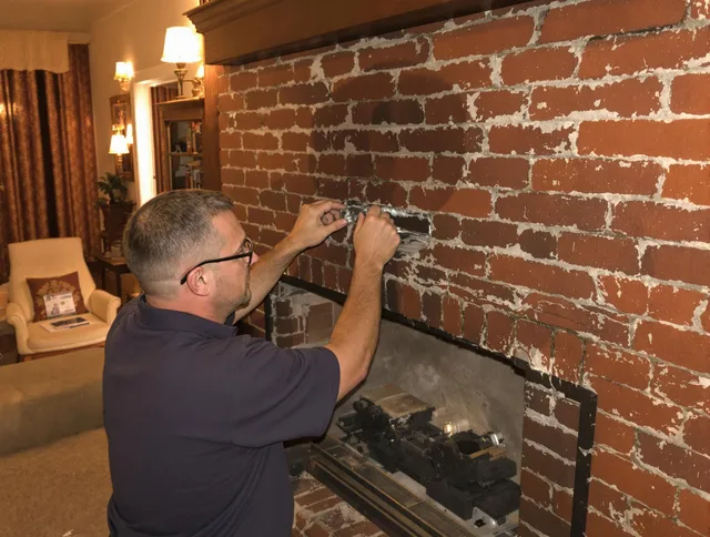 Palm Harbor Chimney Sweep expert fixing a fireplace in Palm Harbor, FL